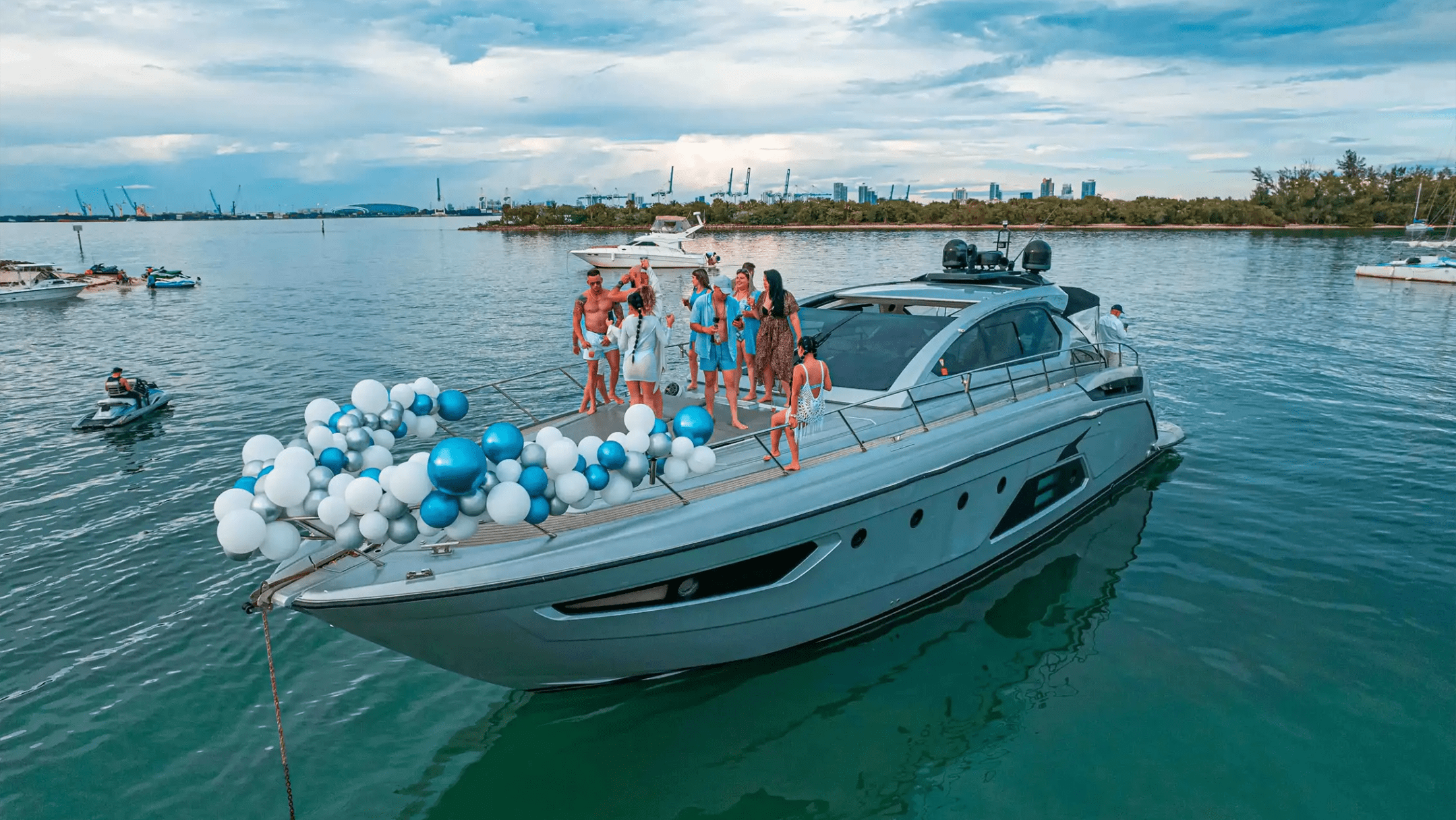 Group enjoying bow lounge on 64′ Atlantis Miami