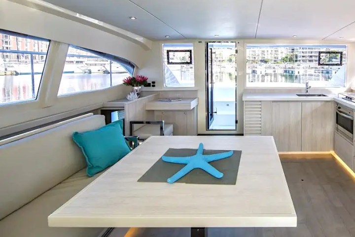 Bright salon interior with panoramic windows aboard 43′ Leopard