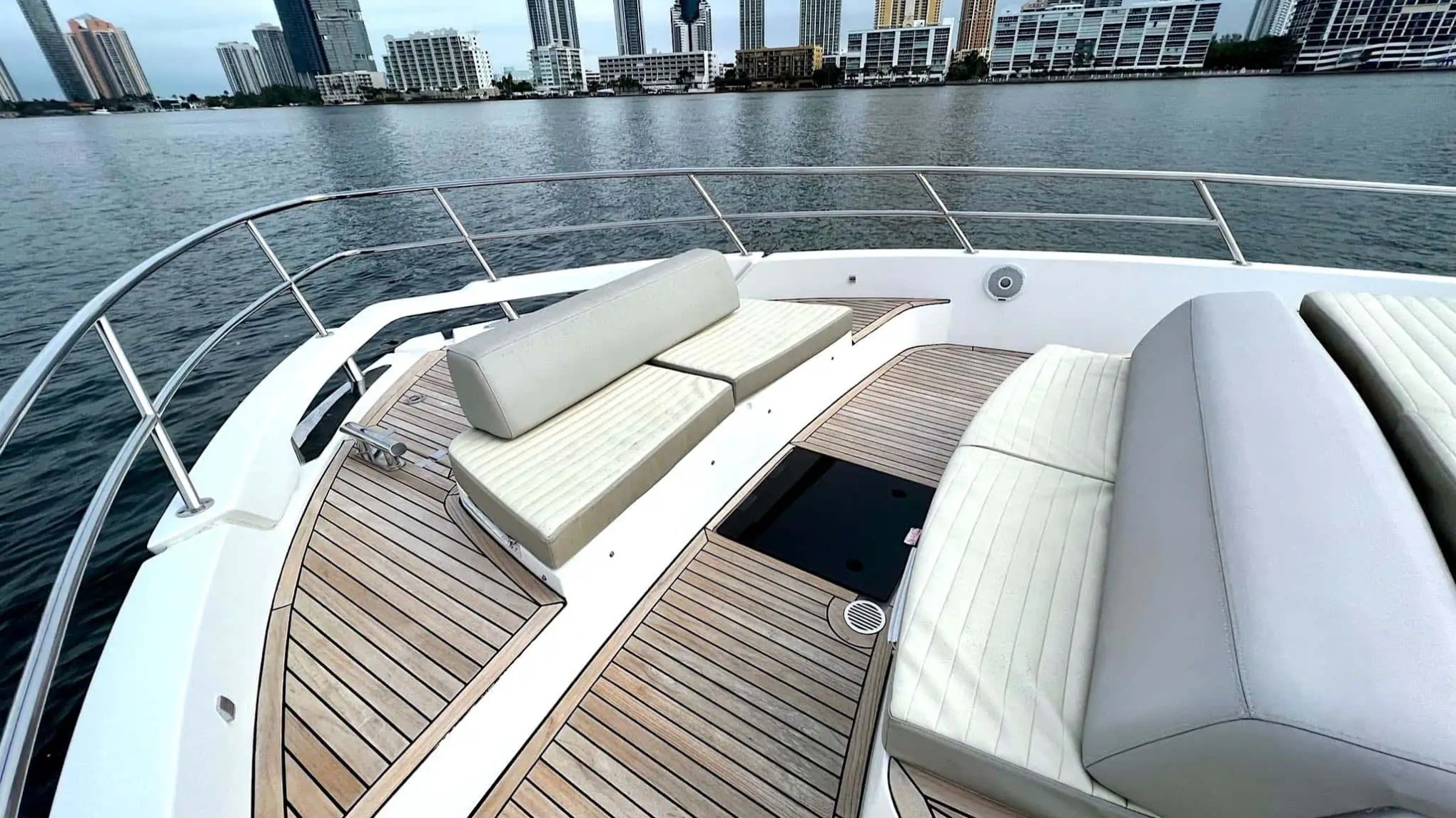 Bow seating area with water view at sunrise