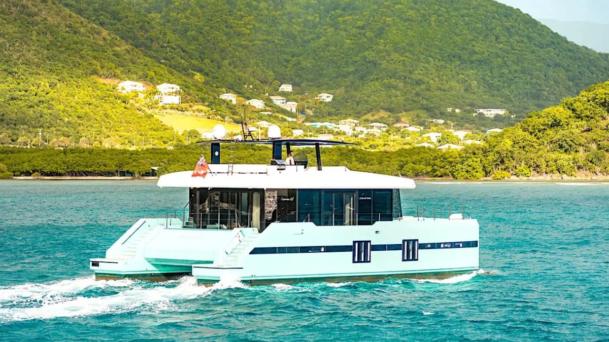 70' Sunreef power catamaran yacht charter cruising tropical coastline