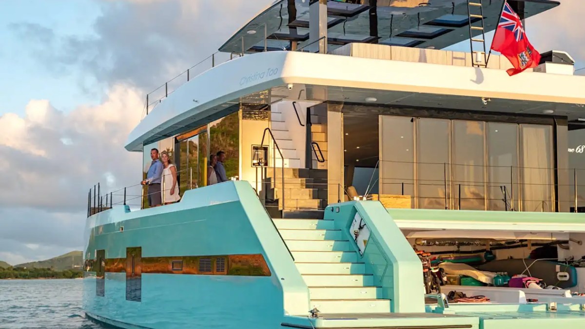 70' Sunreef yacht charter stern view luxury catamaran sunset cruise