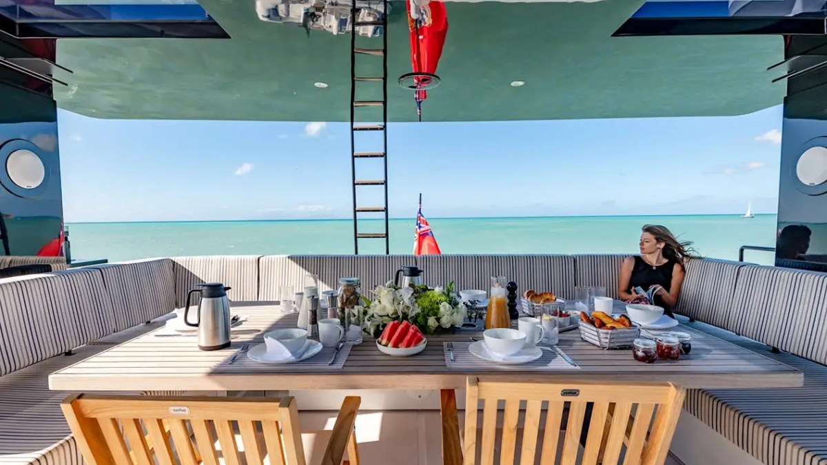 70' Sunreef yacht charter flybridge dining ocean view