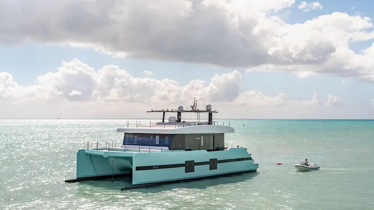 70' Sunreef yacht charter anchored turquoise ocean catamaran