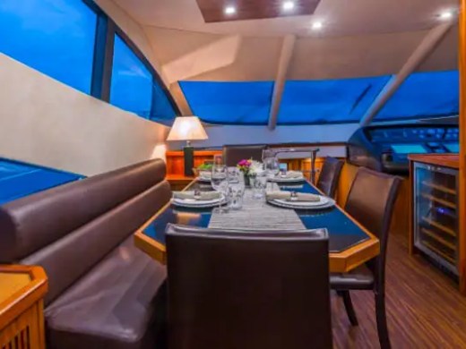 75' Sunseeker yacht charter formal dining area interior in Miami Beach