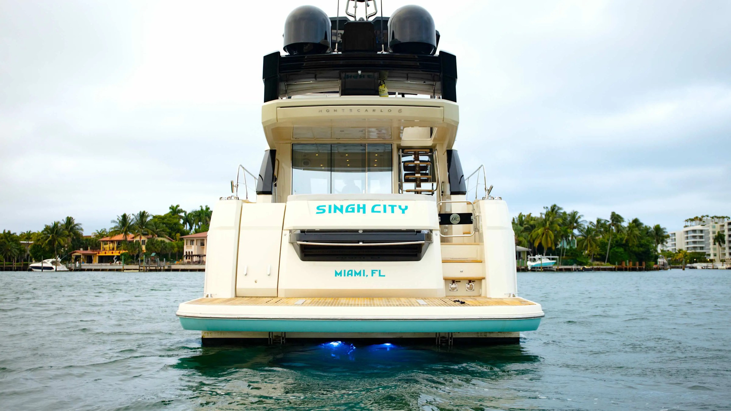 Stern view of 62′ Beneteau yacht anchored in Miami Beach