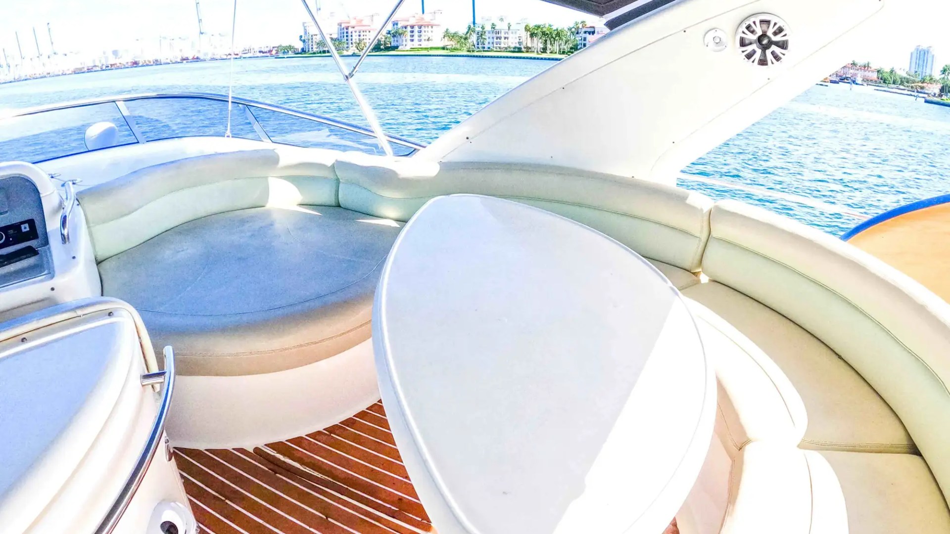 Flybridge table on 57′ Azimut yacht set for social cruising in Miami Beach