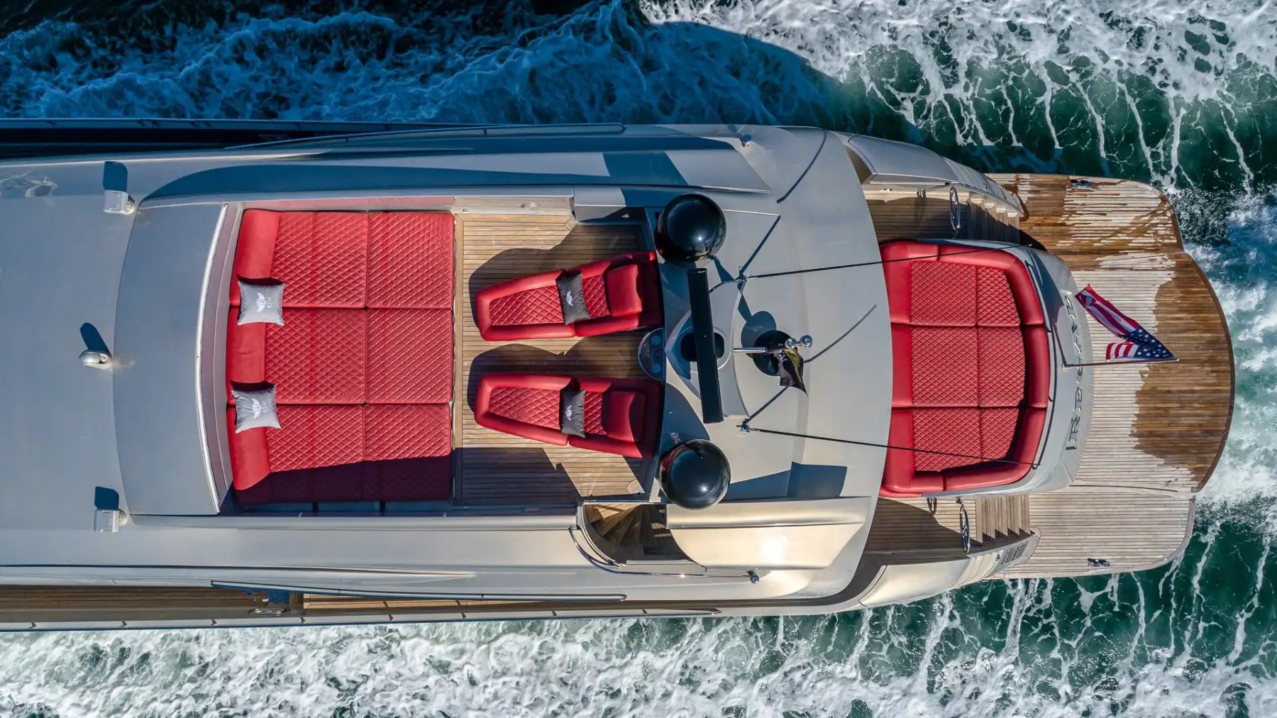 Aerial cruising pass of 90′ Pershing Miami