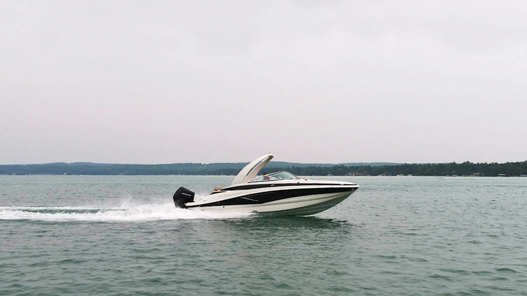 Drone horizontal pass of 27′ Crownline Miami Beach