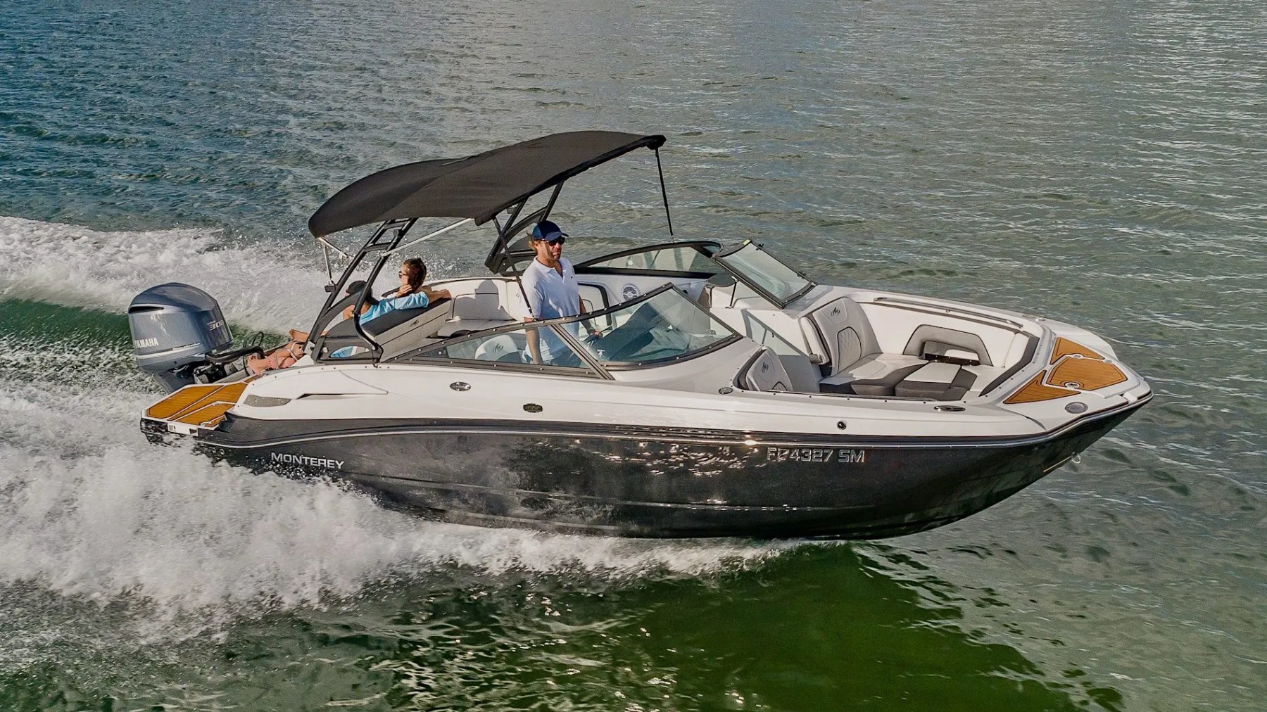 Side profile at anchor on 27′ Monterey Miami Beach