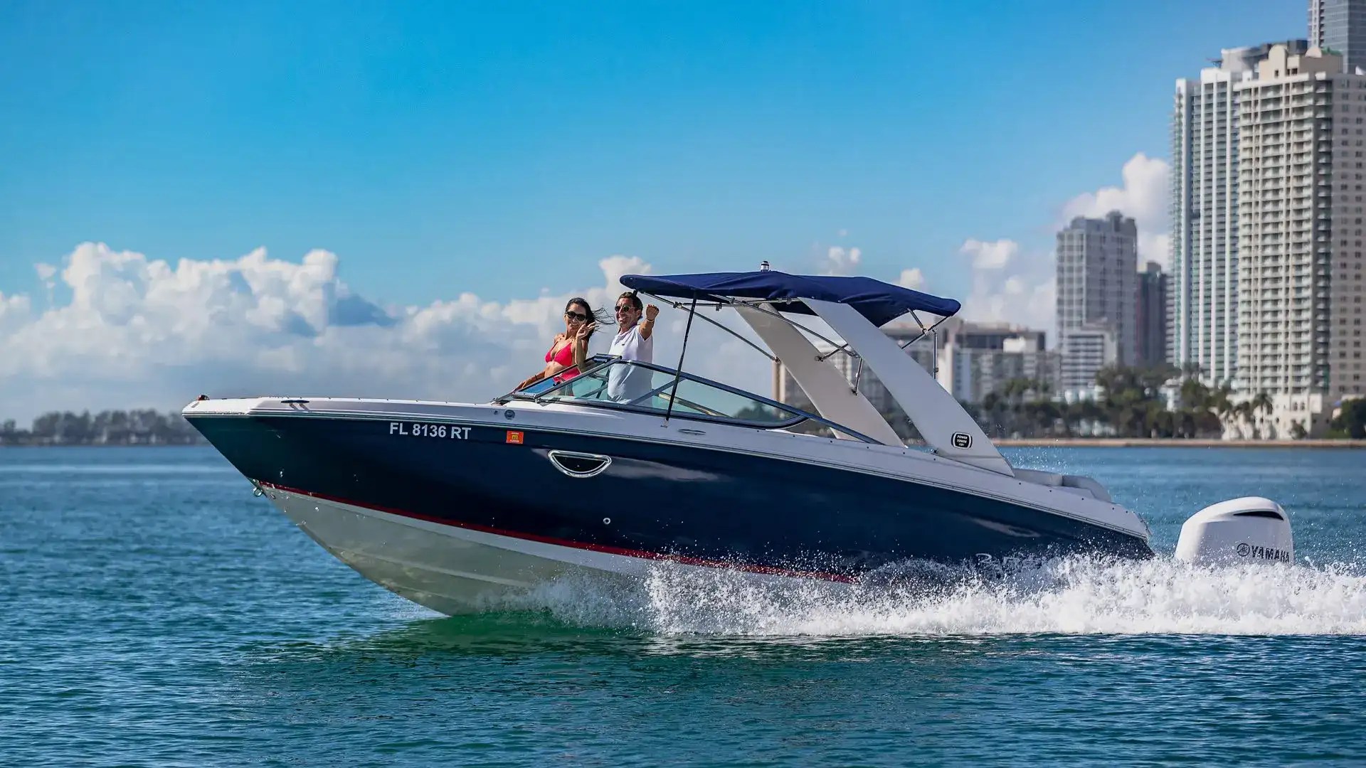 High side aerial pass of 27′ Regal Miami Beach