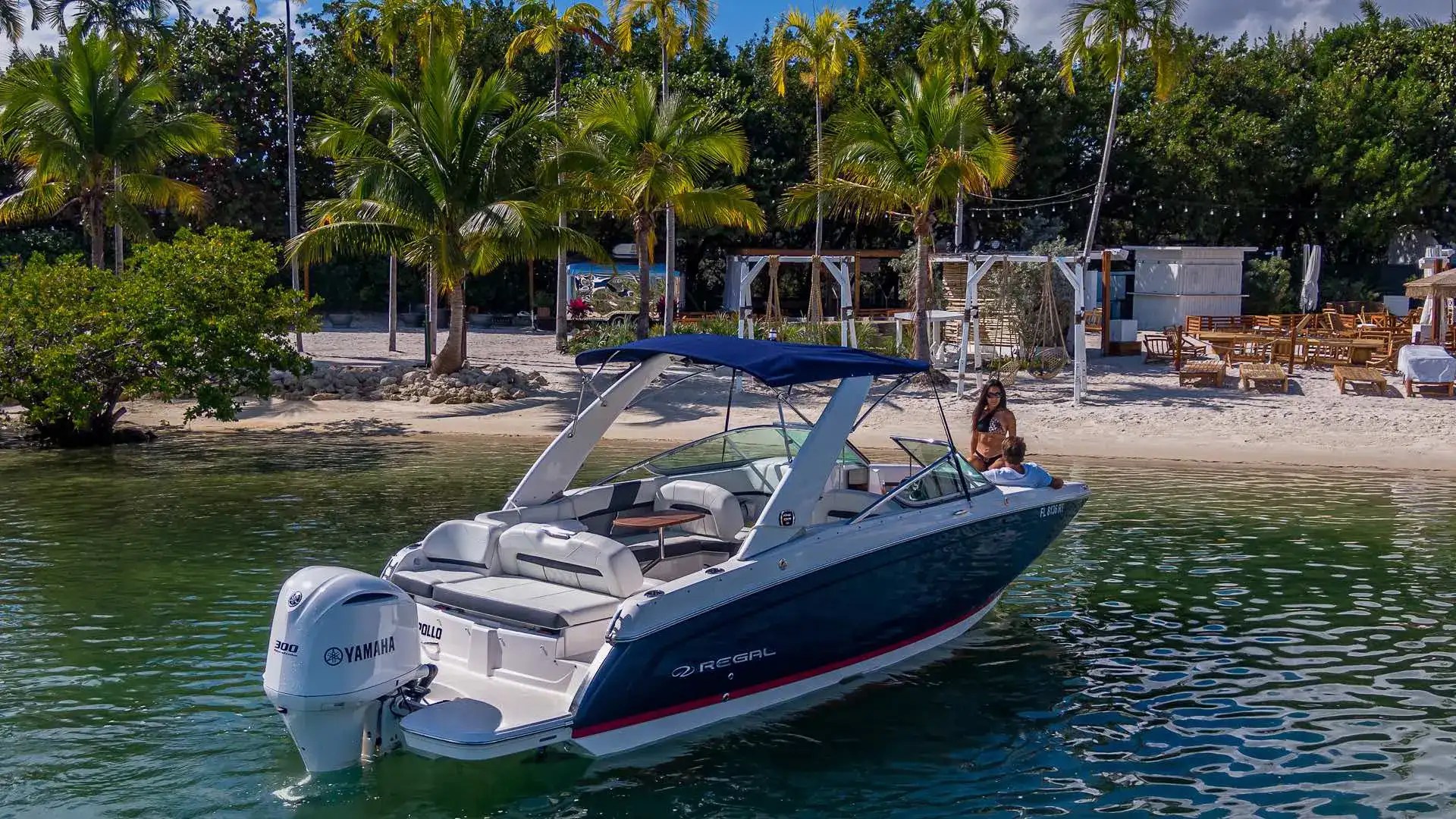 Aft-quarter drone angle on 27′ Regal Miami Beach