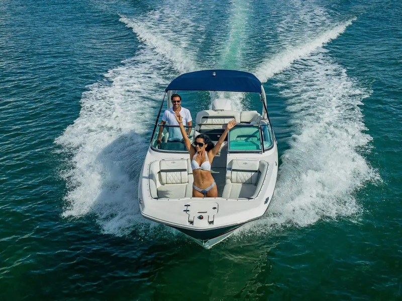 Bow lounge with skyline backdrop on 27′ Regal Miami Beach