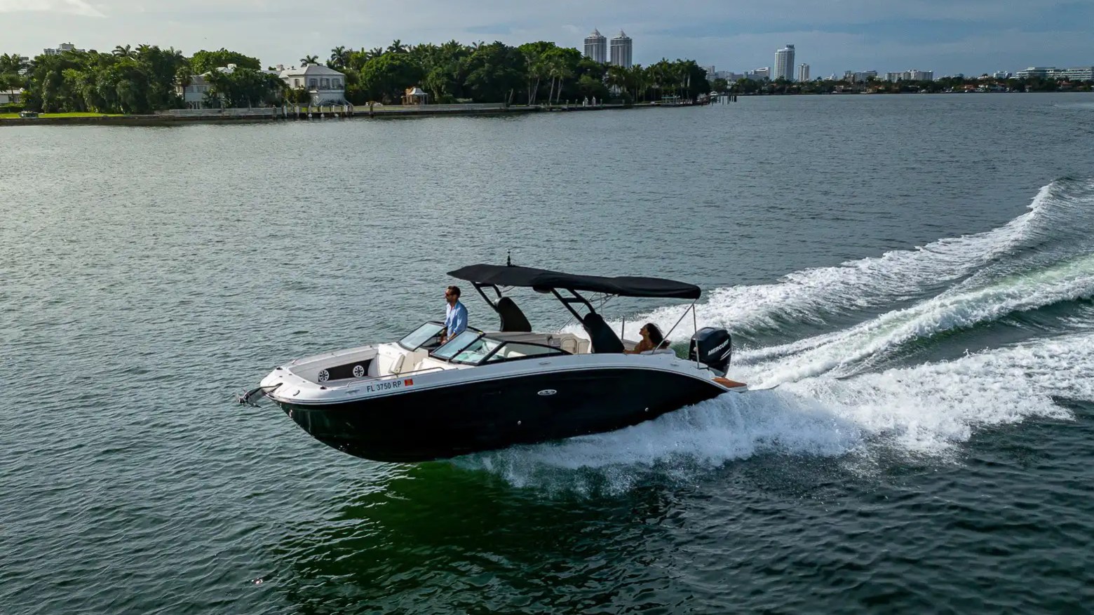 High side aerial pass of 29′ Sea Ray Miami Beach