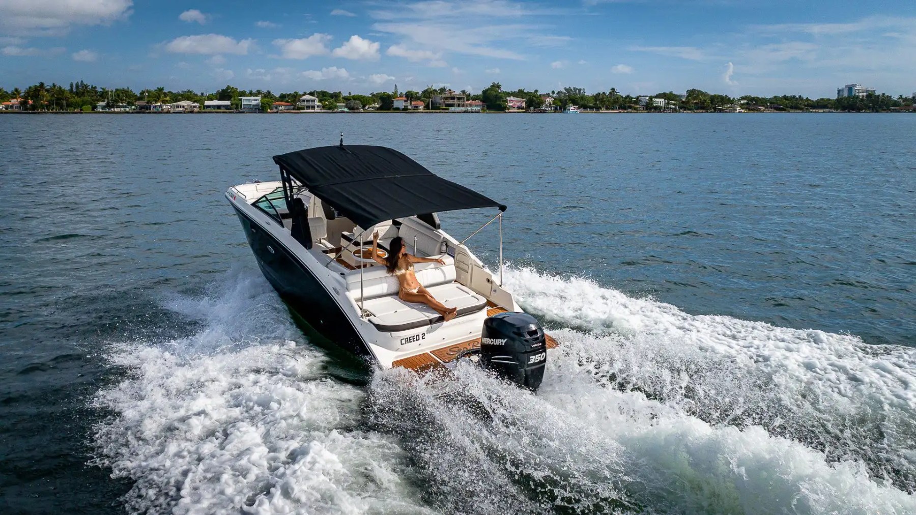 Aft seating with coastline view on 29′ Sea Ray Miami Beach