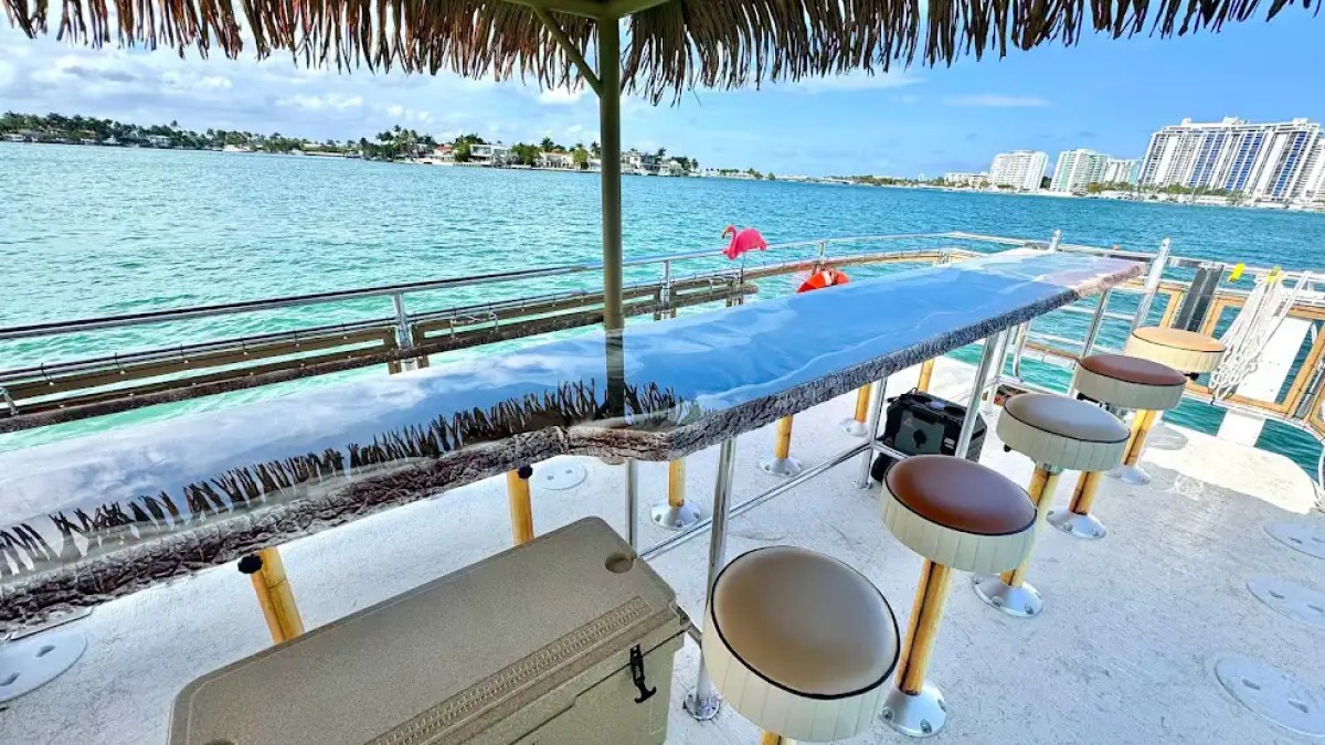 Under-roof dining table on 30′ Tiki – Miami