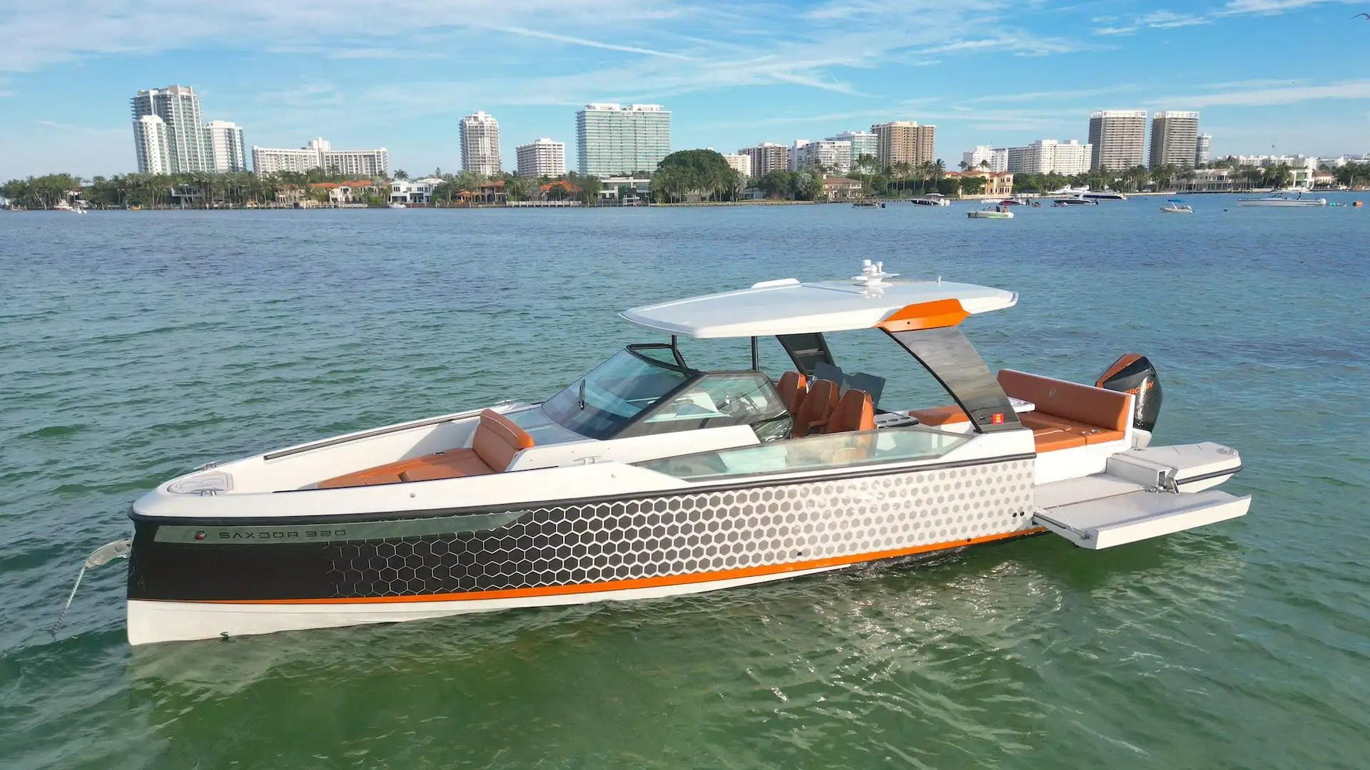 Side aerial pass of 32′ Saxdor Miami Beach