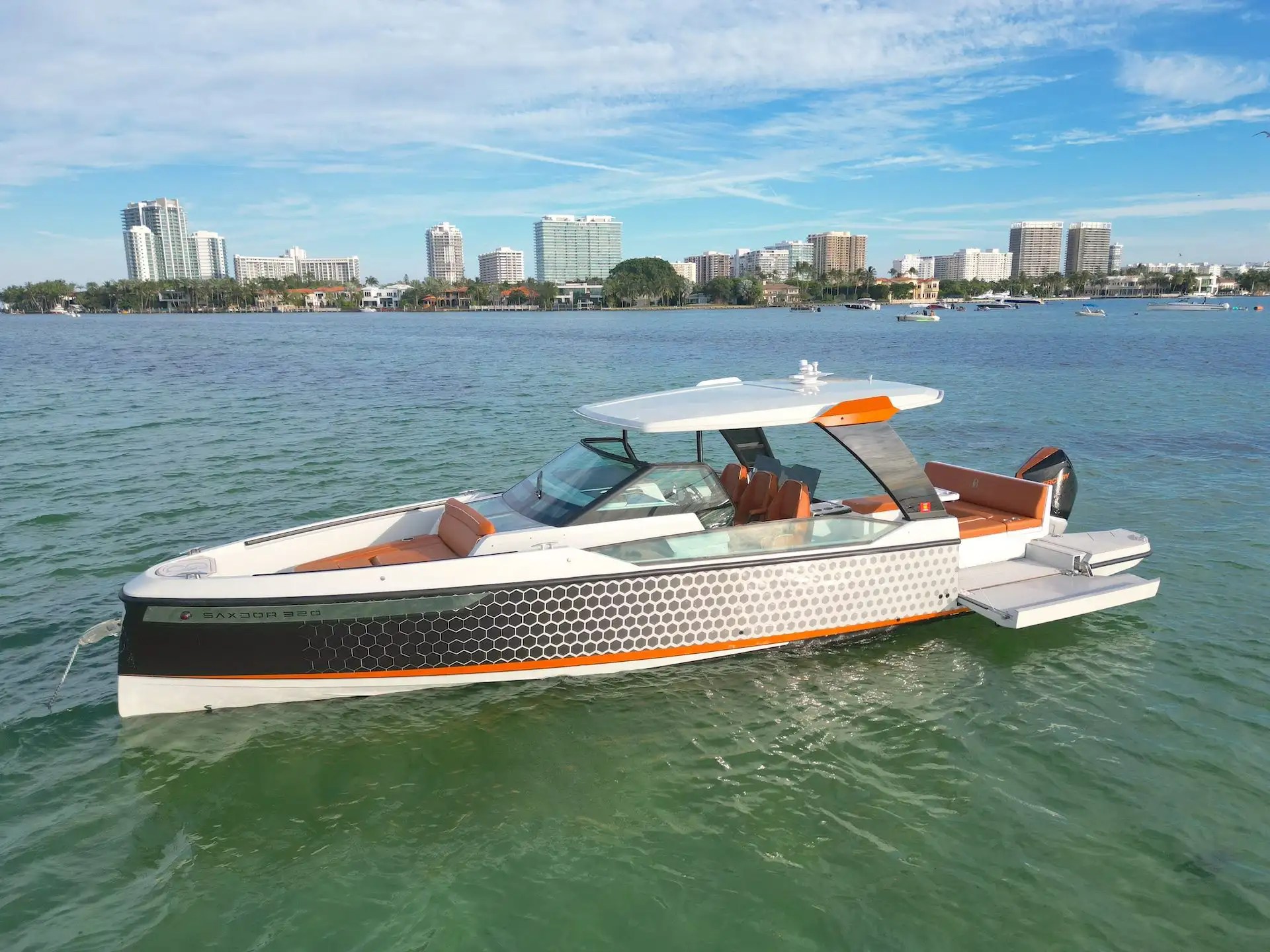 Side aerial pass of 32′ Saxdor Miami Beach