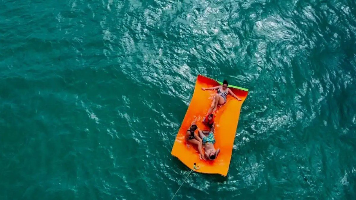 Guest relaxing on magic carpet behind 36′ Monterey Miami Beach