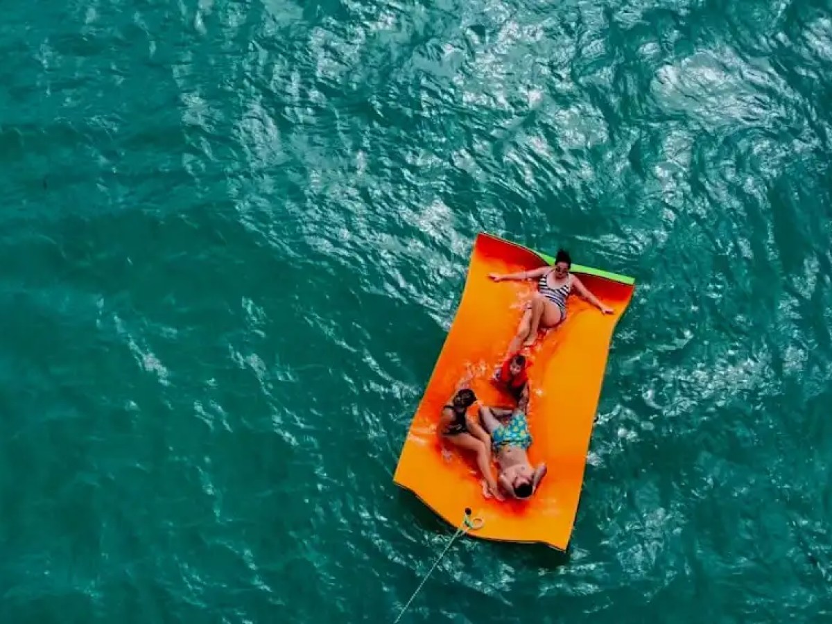 Guest relaxing on magic carpet behind 36′ Monterey Miami Beach