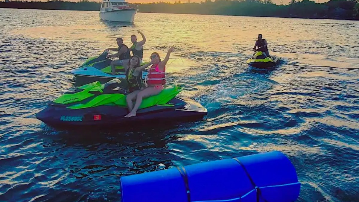 Guests riding jet skis near 36′ Monterey Miami Beach