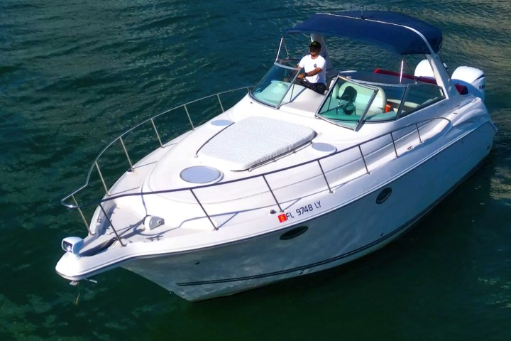 Captain at helm underway on 37′ Monterey Miami