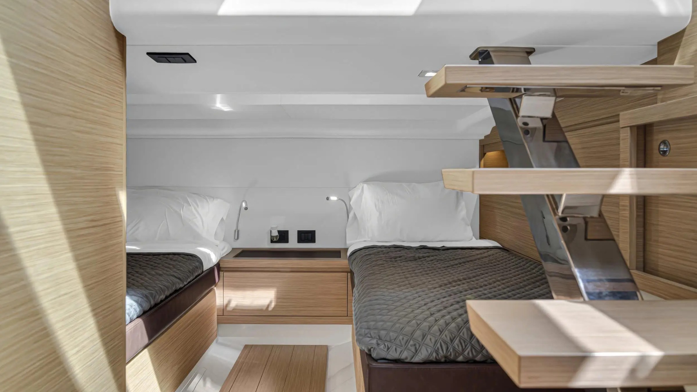 Aft guest sleeping area with twin berths aboard 43′ Pardo boat