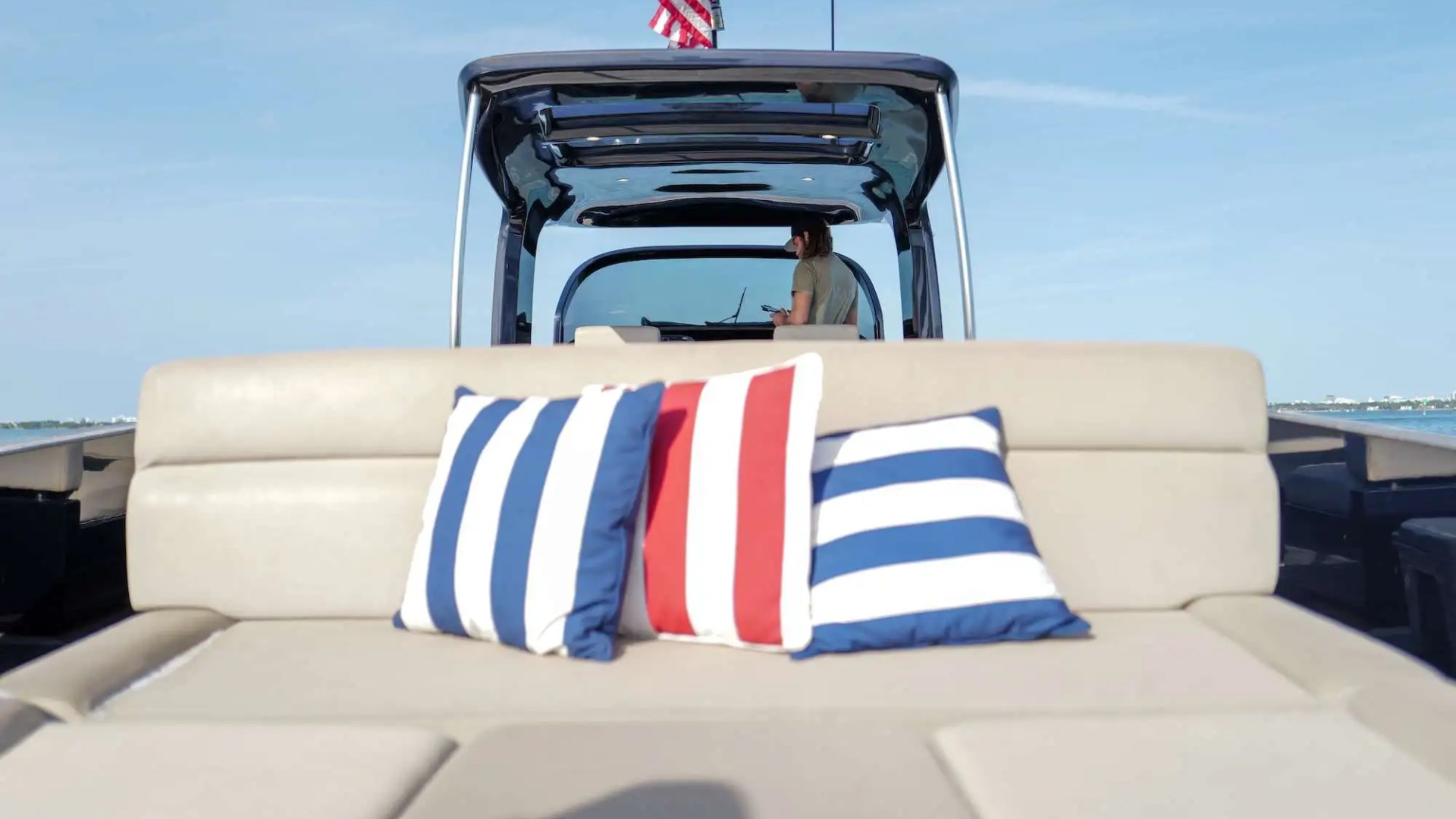 Aft lounge seating on 45′ Alen boat with teak decking