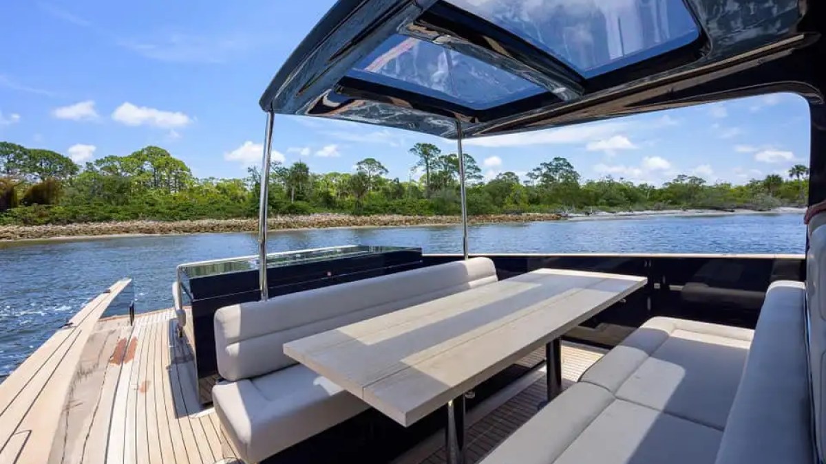 Aft dining table of 45′ Alen boat set on teak deck