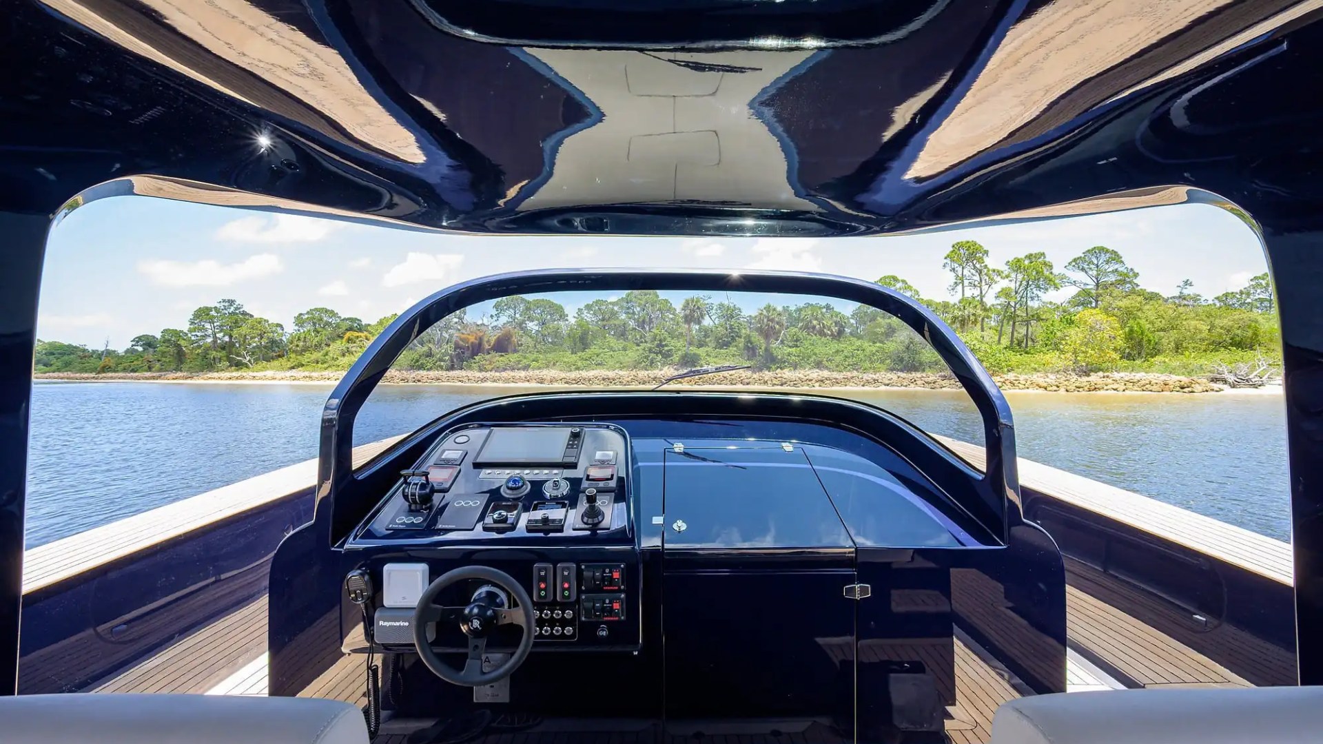 Helm command area of 45′ Alen boat with leather seating