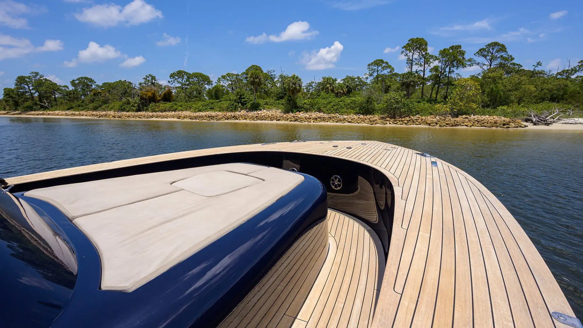 Side walkway of 45′ Alen boat showing teak rails
