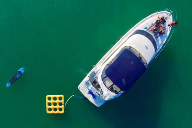 Bow social scene with skyline on 45′ Meridian Miami