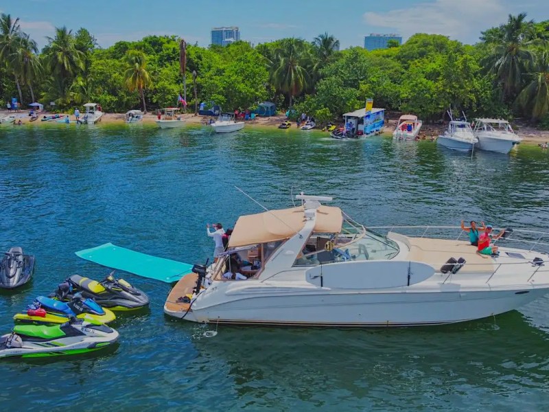 45' SeaRay boat anchored with water toys gathered behind