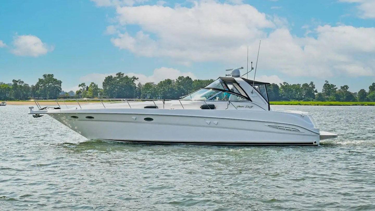 45′ SeaRay boat cruising at sunset