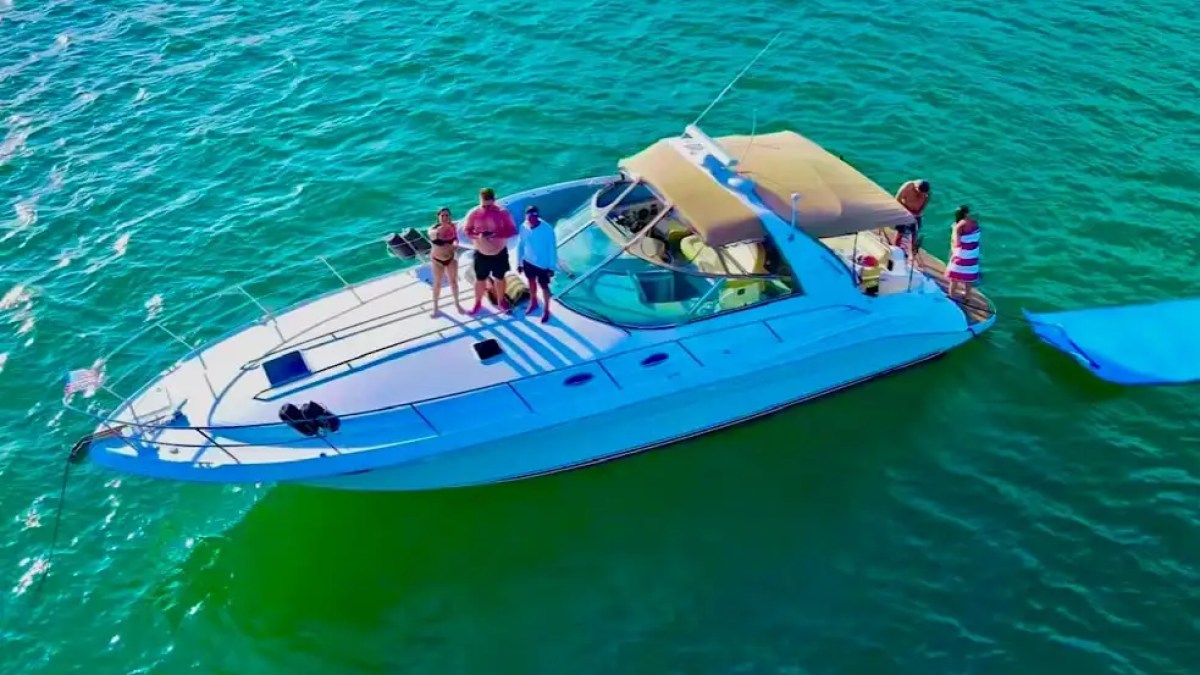 45' SeaRay boat anchored with floating water toys at stern