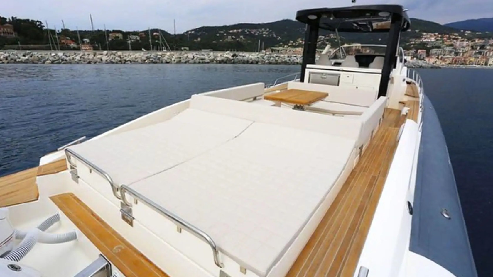 51' Capelli yacht aft deck sunpad set up for lounging in Miami Beach