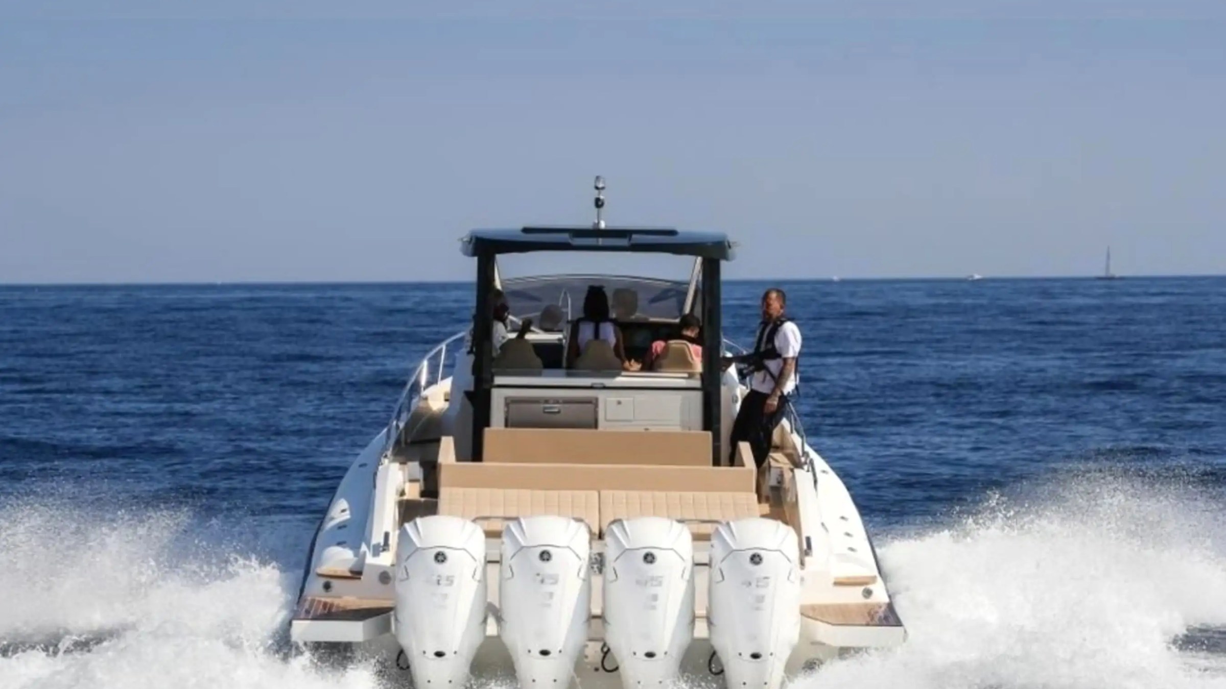 51' Capelli yacht quad V6 outboard engines creating a wide wake trail in Miami Beach