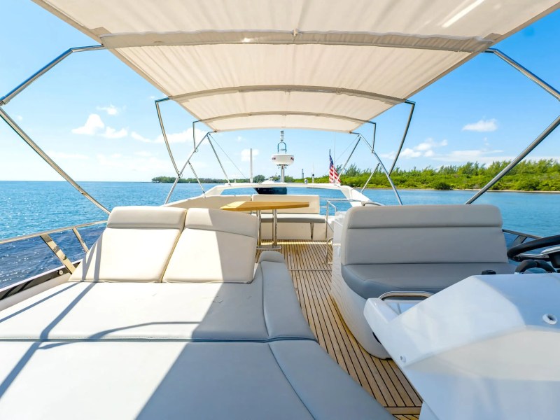 52' Prestige yacht flybridge lounge seating with open water views in Miami Beach