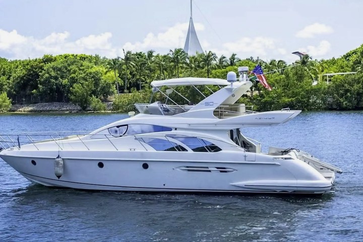 White-hull 53′ Azimut yacht cruising in Miami