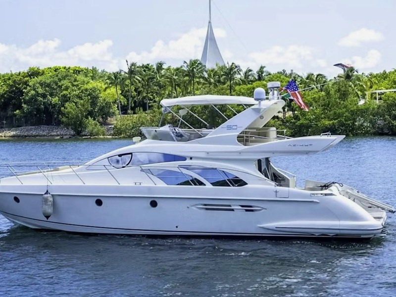 White-hull 53′ Azimut yacht cruising in Miami