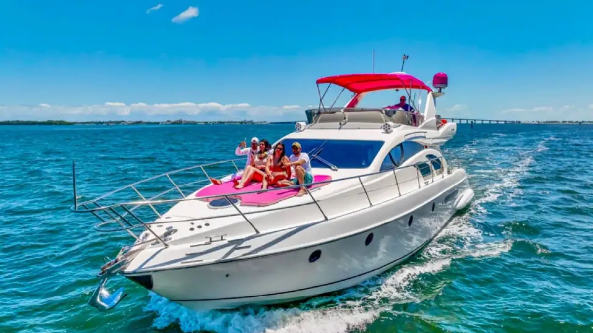 Bow sunpad of 55′ Azimut yacht with skyline view