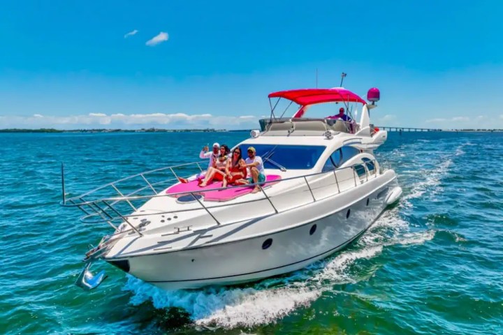 Bow sunpad of 55′ Azimut yacht with skyline view
