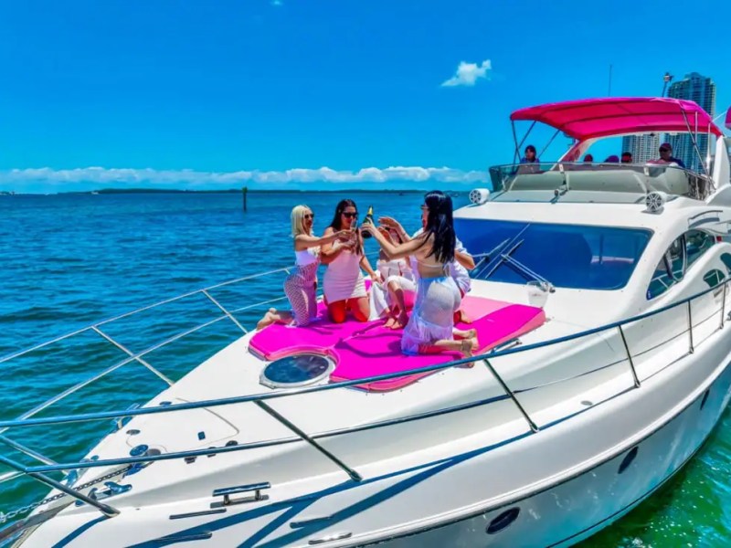 Bow sunpad of 55′ Azimut yacht with skyline view