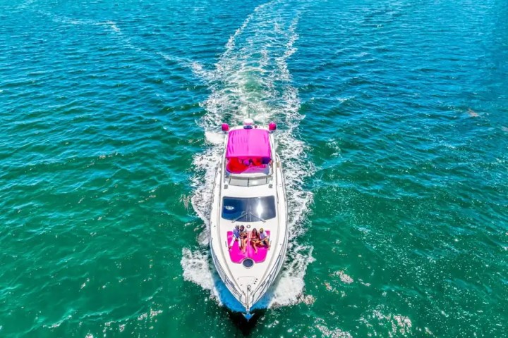 Flybridge lounge of 55′ Azimut yacht underway