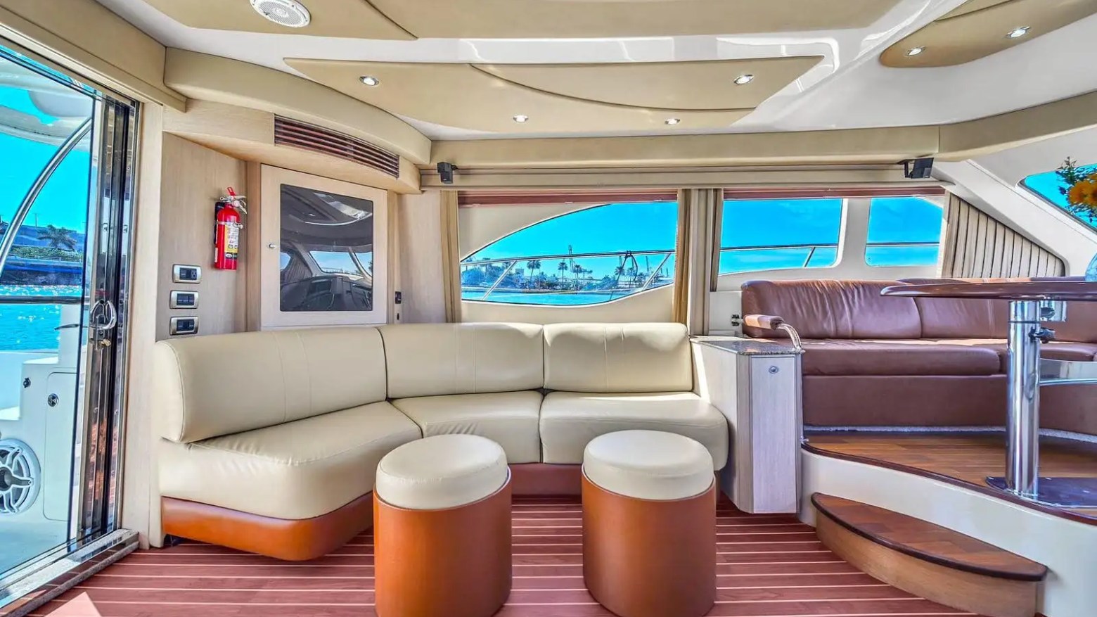 Seating area near entry doors inside 56′ SeaRay yacht in Miami Beach