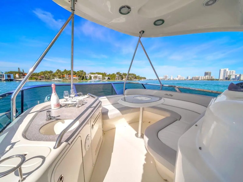 Lounging area on flybridge of 56′ SeaRay yacht in Miami Beach