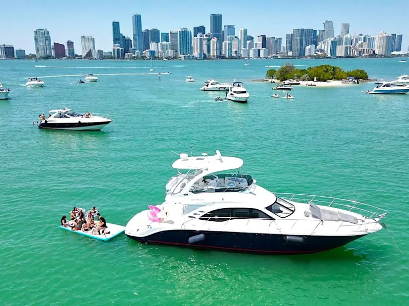 Side aerial drone pass of 29′ Sea Ray Miami Beach