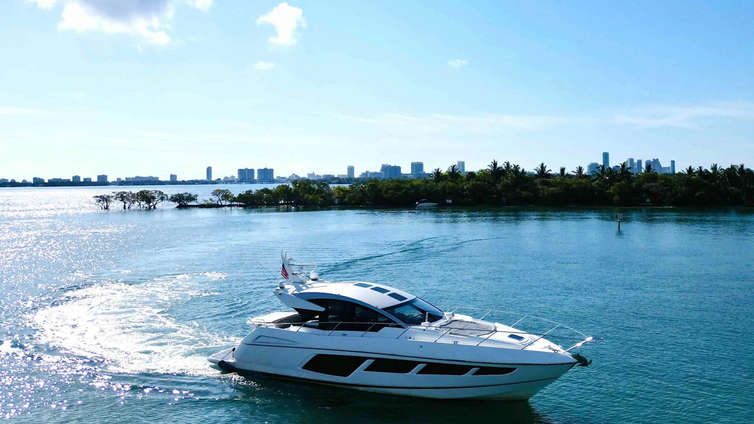 60ft Sunseeker yacht Miami cruising wake trail with guests