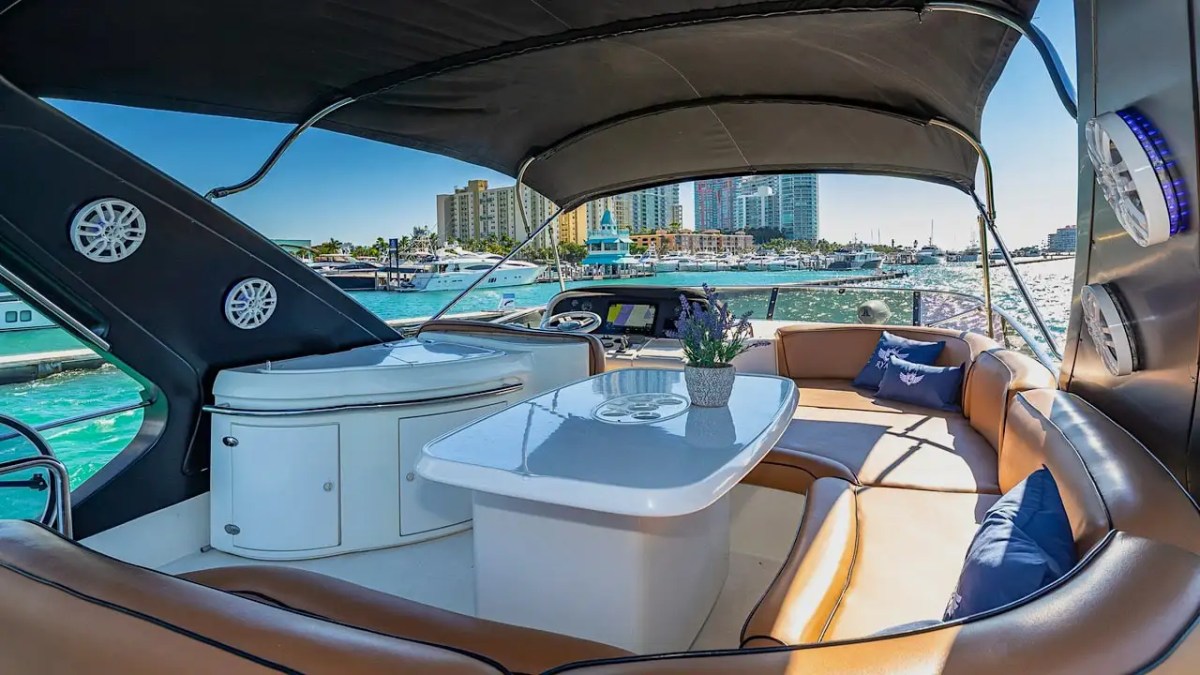 62′ Azimut 2 yacht forward seating with skyline reflection