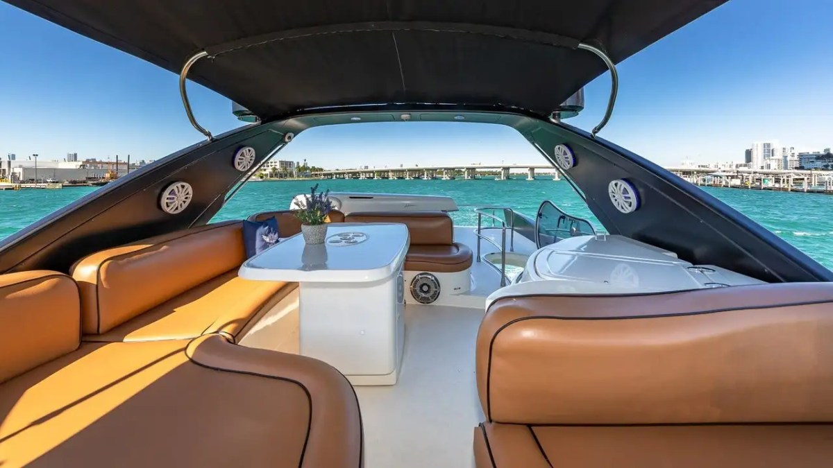Flybridge lounge seating on the 62′ Azimut 2 yacht overlooking Miami Beach waters
