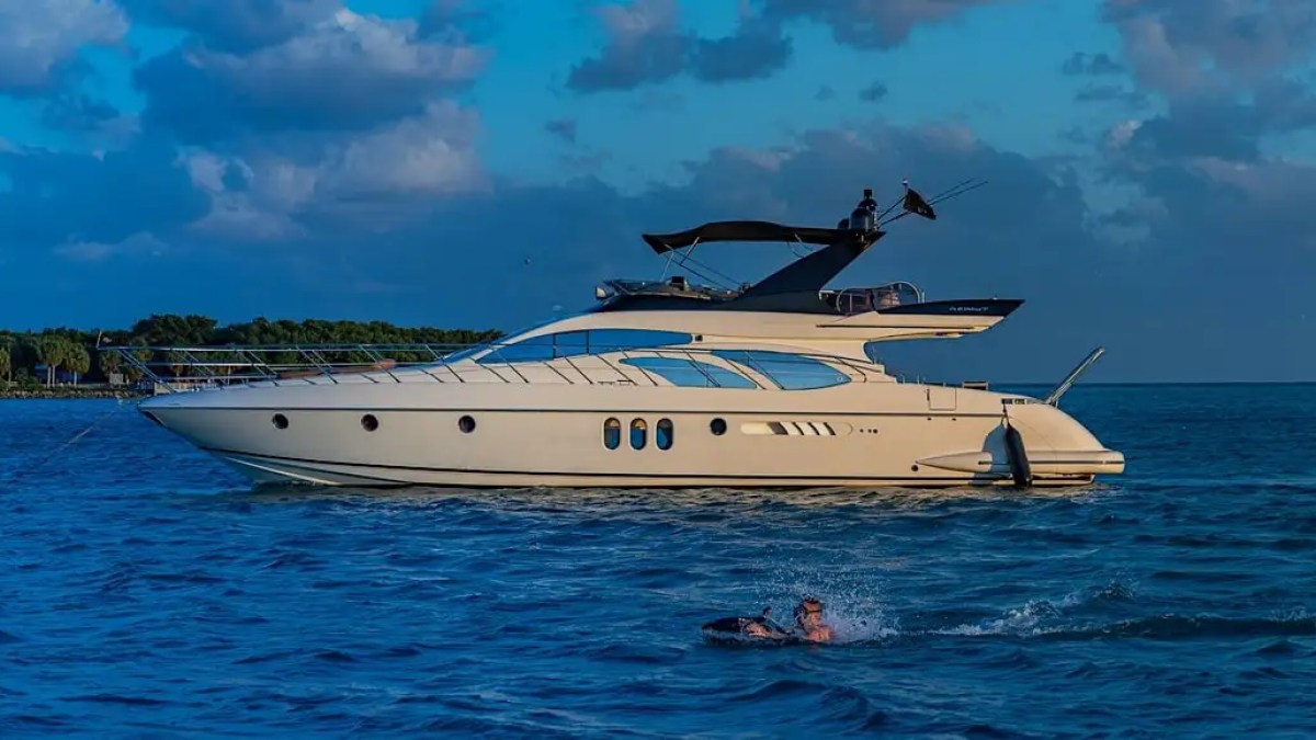 62′ Azimut 2 yacht side profile with skyline backdrop